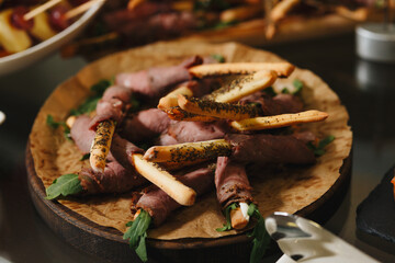 Delicious Herb-Crusted Breadsticks Wrapped in Meat