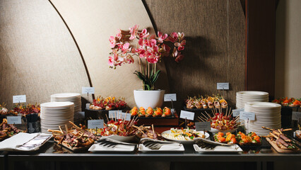 Elegant Buffet Table with Appetizers and Flowers