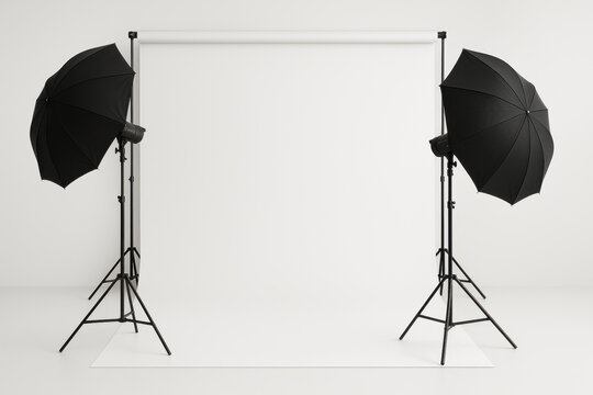 Photo studio with lighting equipment and white backdrop ready for a photoshoot