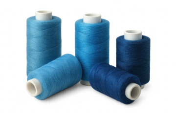 Four blue sewing threads lying on transparent background