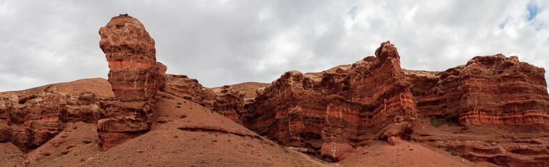 Fototapeta premium Expansive view of Kazakh canyon's red rock labyrinth shaped by millennia of erosion