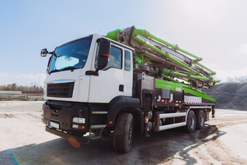 Concrete mixer truck parked at construction site on sunny day