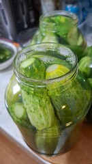  green cucumbers, pickled in glass jars, healthy food, delicious food