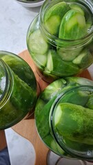  green cucumbers, pickled in glass jars, healthy food, delicious food