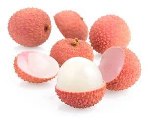 Fresh lychees, whole and sliced, against white