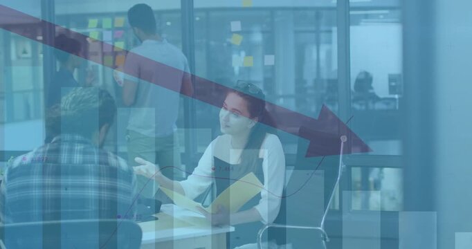 Business woman opening folder flipping charts pointing as man gesturing toward down arrow on notes