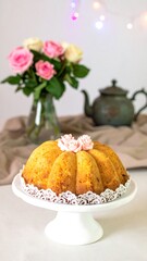 A cake with flowers, tea