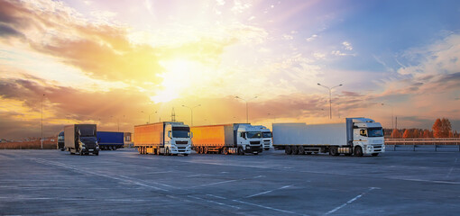 Trucks in parking lot on suburban highway