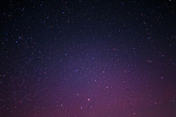 Fototapeta premium Night Sky with Colorful Sparkling Stars, Glowing Constellations, and Dreamy Magical Atmosphere