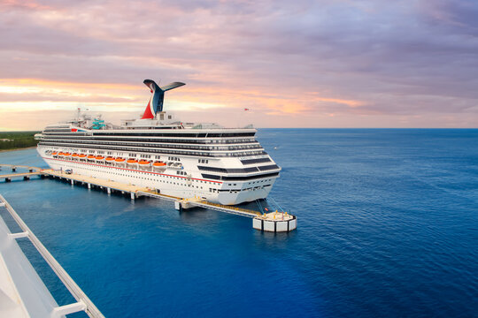 Large Carnival cruiseliner called Carnival Triumph at Puerta Maya Pirs in, International pier in Cozumel, Mexico.