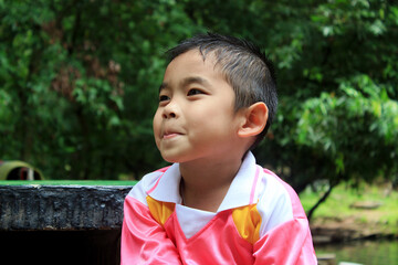 The joy and happiness shown on the boy's face.