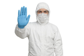 Doctor wearing hazmat suit showing stop sign with transparent background