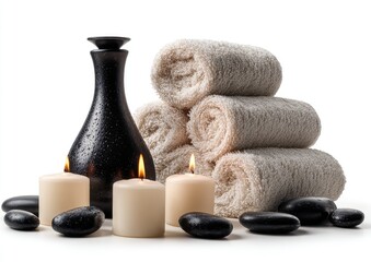 Spa still life featuring dark-hued, textured bottle, stacked towels, candles, and stones