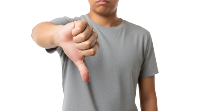 Person expressing negativity through thumbs down gesture against a bright background portraying discontent or disapproval, and the power of