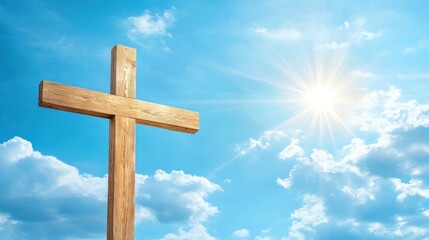 Wooden cross against sky with sunlight