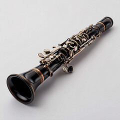 Obraz premium Elegant black clarinet with silver keys, carefully aligned on white surface.