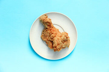 Fast Food Fried Chicken on a plate with a blue background
