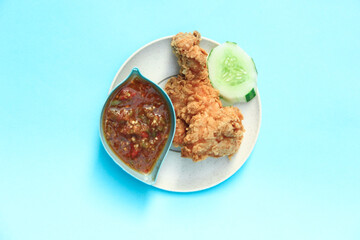 Ayam Geprek or Chicken crush Indonesian food Crispy fried chicken with hot and spicy chili sauce Sambal Sauce Served delicious recipe