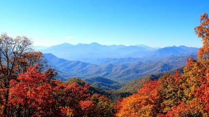 Vibrant autumn mountain landscape with colorful fall foliage and hazy blue peaks