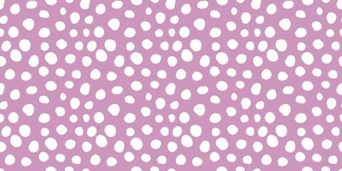 Aesthetic pattern of white dots of different sizes on a soft purple background. 