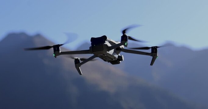 Flying drone taking off in summer grassland