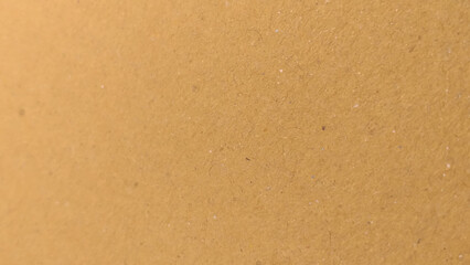 Background of brown kraft paper or cardboard texture. copy space background in beige yellow, brown.
