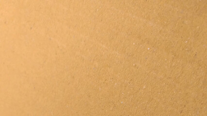 Background of brown kraft paper or cardboard texture. Beige surface background texture light rough textured spotted blank.
