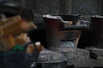 Close-up of an old charcoal stove in the kitchen. Rural lifestyle.