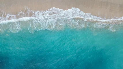 Rugzak Luchtfoto Strand Aerial view of turquoise sea waves crashing on sandy beach creating natural abstract pattern  © Miftakhul Fariz