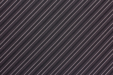Obraz premium Elegant dark fabric with diagonal stripes in subtle textures for fashion and design projects