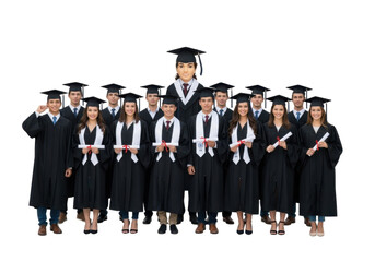 Group of Graduates Celebrating Their Achievement in Academic Caps and Gowns with Diplomas in Hand