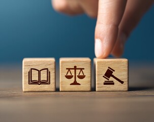 Hand placing wooden blocks with legal symbols