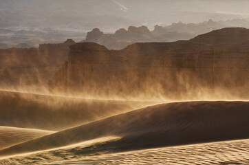 Majestic Gobi desert landscape with amazing wind and fierce sandstorm at sunset