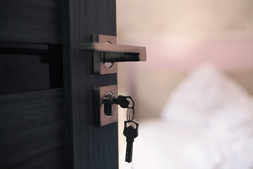 open key on wooden door