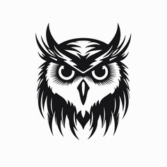 Majestic owl staring forward with captivating eyes in striking black silhouette