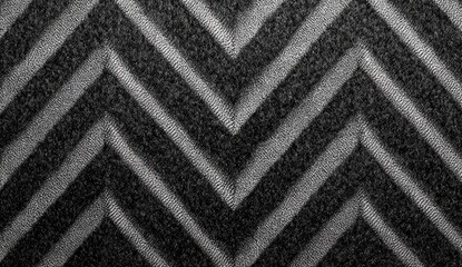Abstract textured black and gray chevron pattern