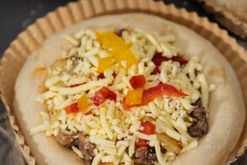 Delicious Homemade Pizza Topped with Beef, Bell Peppers, and Cheese