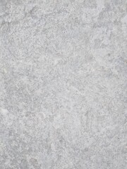 This photo shows a close-up view of a gray textured concrete surface with a slightly rough and grainy pattern.