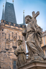 Obraz premium statues on the Charles Bridge, evening Prague. Czech Republic