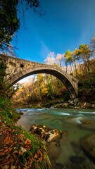 Obraz premium Autumnal Bridge Over River