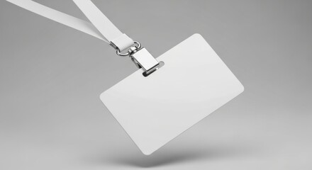 Blank white name tag with lanyard on a gray background ready for customization and branding