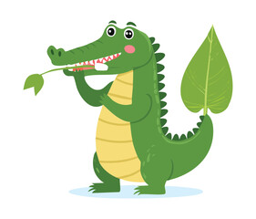  A cute crocodile is eating a big green leaf ready to enjoy a healthy and fresh meal in the swamp