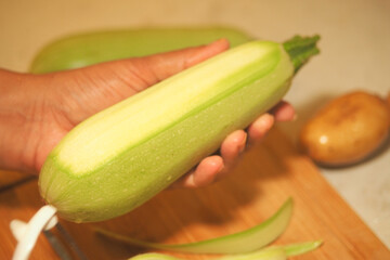 Preparing fresh zucchini for a healthy meal
