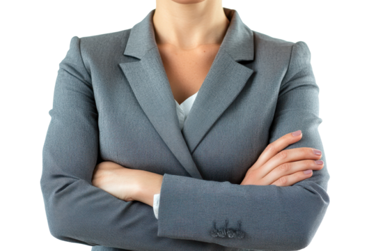 Businesswoman showcases confidence with crossed arms in a professional setting emphasizing leadership and determination in the corporate world