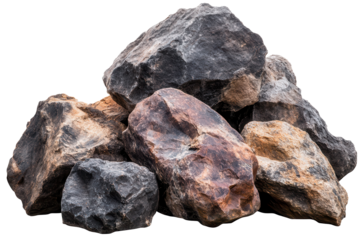 Collection of rough boulders exhibiting varied textures and colors found in natural landscape near mountain range
