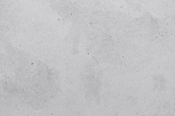 Fototapeta premium Aged concrete surface with subtle grey spots and speckled texture