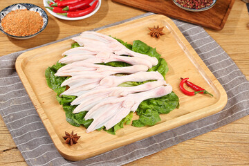 Raw Duck Feet with Vegetables and Spices on Wooden Cutting Board - Asian Cooking Ingredients