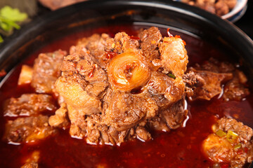 Spicy Oxtail Bone Stew with Fresh Vegetables in Traditional Pot - Hearty Comfort Food