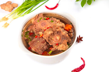 Spicy Stewed Oxtail Soup with Bone Marrow and Vegetables in White Bowl