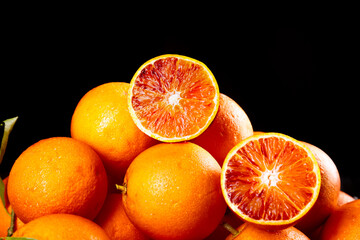 Blood Oranges from Zizhong Sichuan China Fresh Citrus Fruit with Deep Red Orange Flesh Black Background